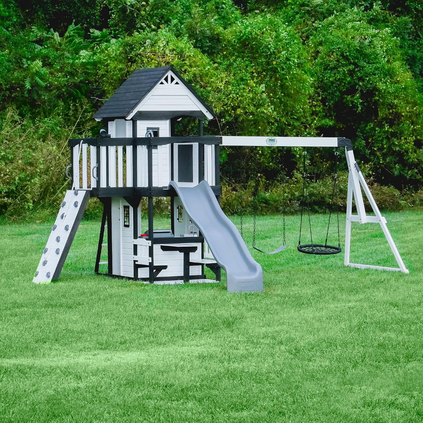 2025 Backyard Discovery Canyon Creek Set de Juego Exterior en Madera de Cedro con Tobogán, Casa en el Árbol, Columpios y Pared de Escalada